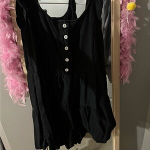 black linen button up romper with ruffle sleeve